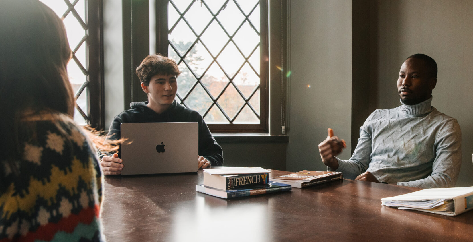 professor mid-discussion with students